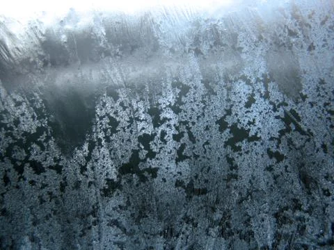Frosty pattern on winter window Stock Photos