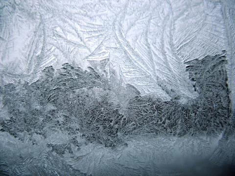 Frosty pattern on winter window Stock Photos