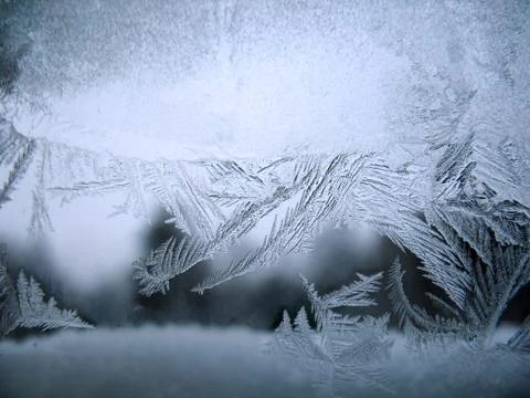 Frosty pattern on winter window Stock Photos