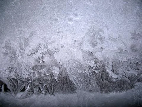 Frosty pattern on winter window Stock Photos