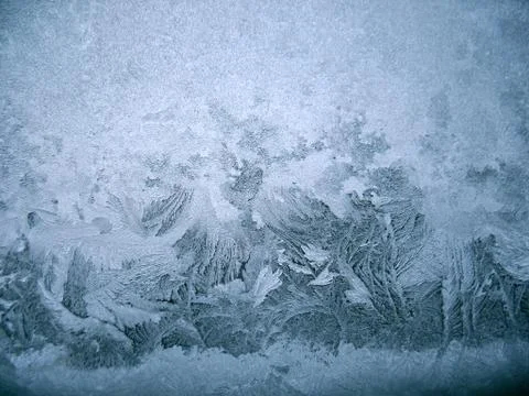 Frosty pattern on winter window Stock Photos