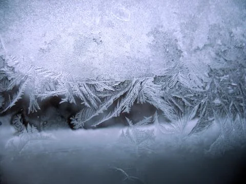 Frosty pattern on winter window Stock Photos