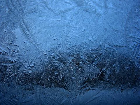 Frosty pattern on winter window Stock Photos