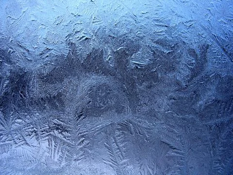 Frosty pattern on winter window Stock Photos