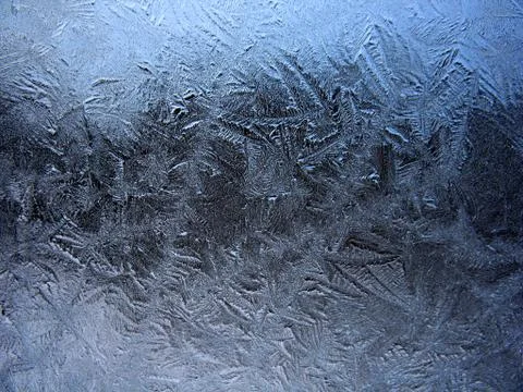 Frosty pattern on winter window Stock Photos