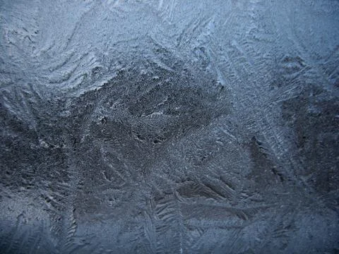 Frosty pattern on winter window Stock Photos