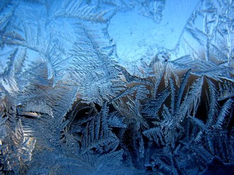 Frosty pattern on winter window Stock Photos