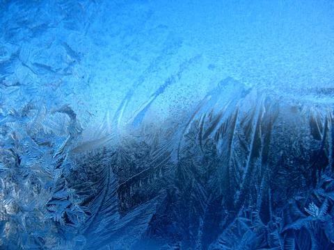 Frosty pattern on winter window Stock Photos