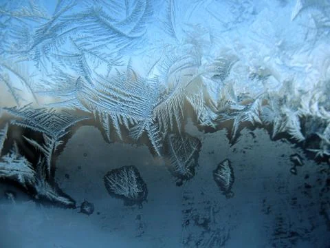 Frosty pattern on winter window Stock Photos