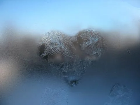 Frosty pattern on winter window Stock Photos