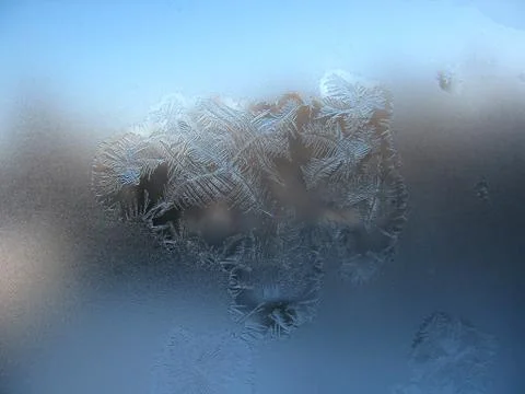 Frosty pattern on winter window Stock Photos