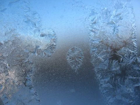Frosty pattern on winter window Stock Photos