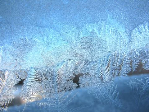 Frosty pattern on winter window Stock Photos