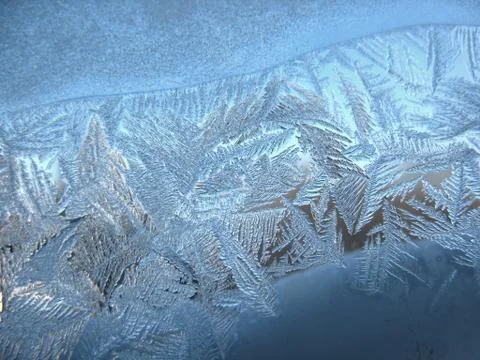Frosty pattern on winter window Stock Photos