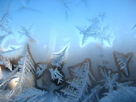 Frosty pattern on winter window Stock Photos