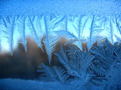 Frosty pattern on winter window Stock Photos