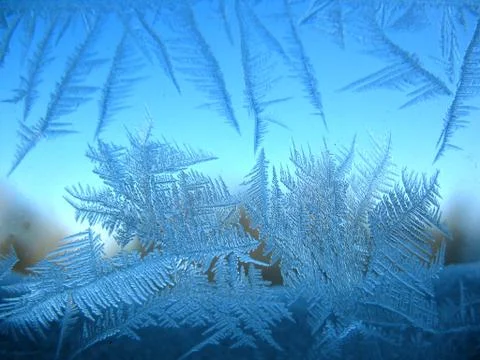 Frosty pattern on winter window Stock Photos
