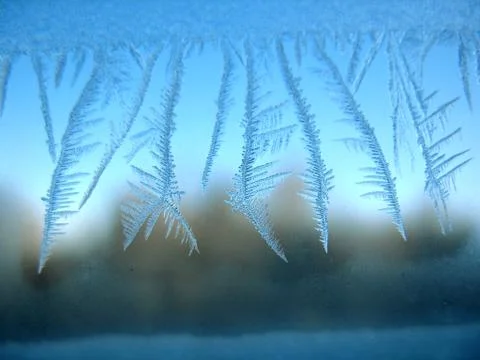 Frosty pattern on winter window Stock Photos