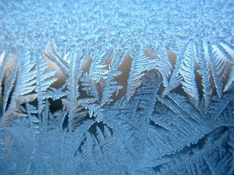Frosty pattern on winter window Stock Photos