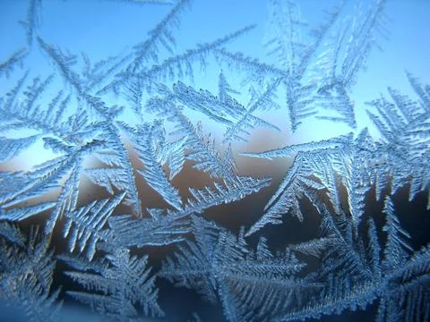 Frosty pattern on winter window Stock Photos
