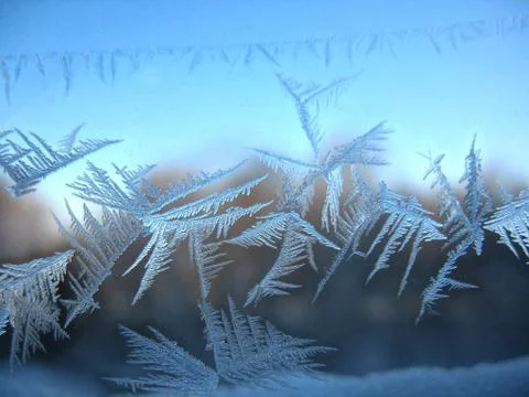 Frosty pattern on winter window Stock Photos