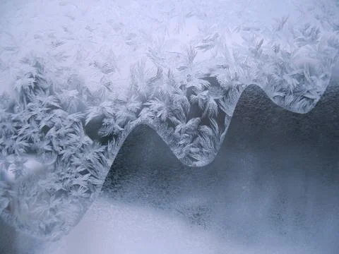 Frosty pattern on winter window Stock Photos