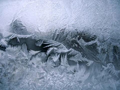 Frosty pattern on winter window Stock Photos