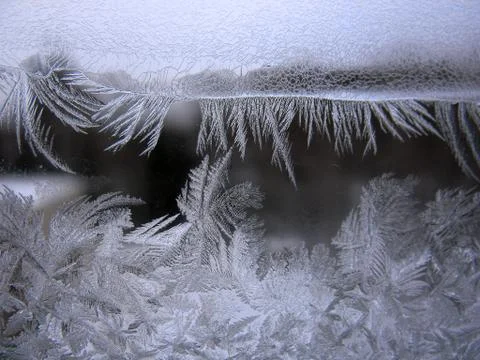 Frosty pattern on winter window Stock Photos