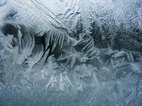 Frosty pattern on winter window Stock Photos
