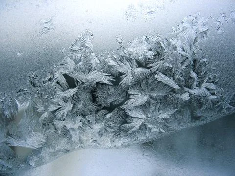 Frosty pattern on winter window Stock Photos