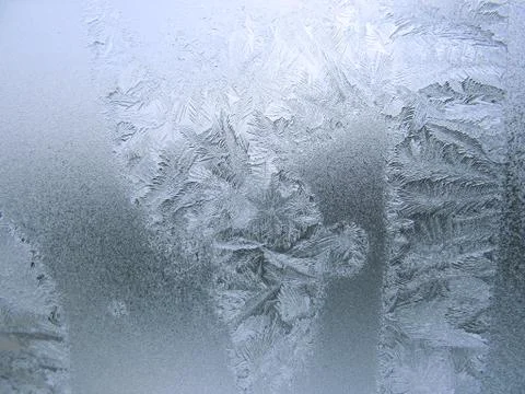 Frosty pattern on winter window Stock Photos