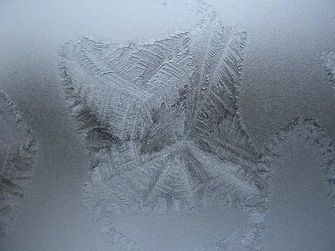Frosty pattern on winter window Stock Photos