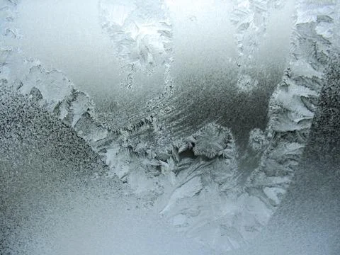 Frosty pattern on winter window Stock Photos