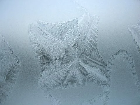 Frosty pattern on winter window Stock Photos