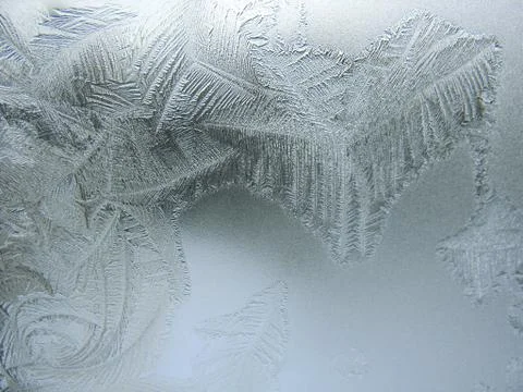 Frosty pattern on winter window Stock Photos