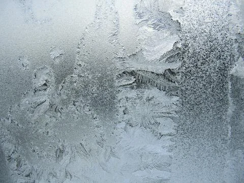 Frosty pattern on winter window Stock Photos