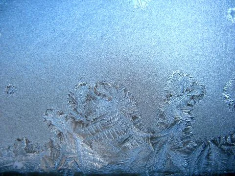 Frosty pattern on winter window Stock Photos