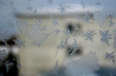 Frosty pattern on winter window Stock Photos