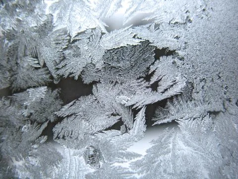 Frosty pattern on winter window Stock Photos