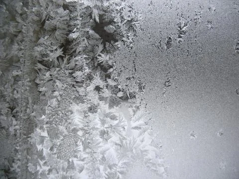 Frosty pattern on winter window Stock Photos