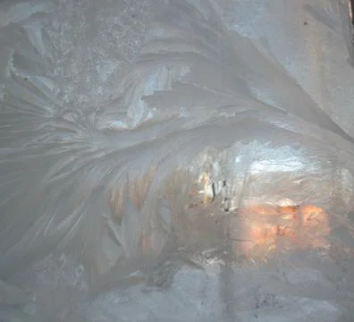 Frosty pattern on winter window Stock Photos