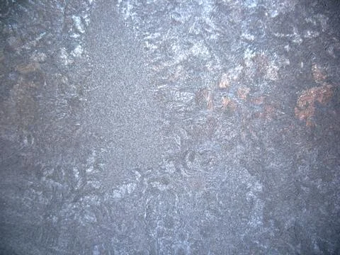 Frosty pattern on winter window Stock Photos