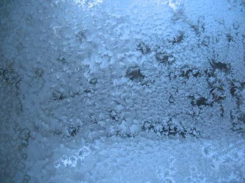 Frosty pattern on winter window Stock Photos