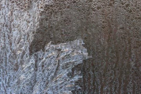 Frosty patterns on a frozen ice box in the early morning Stock Photos