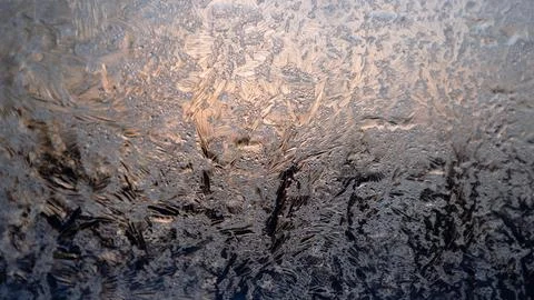 Frosty patterns on glass. Crystal structure, abstract Stock Photos