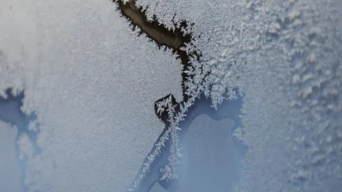 Frosty patterns on glass. Crystal structure, abstract Stock Photos