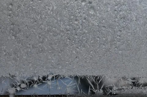 Frosty patterns on glass Stock Photos