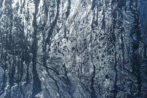 Frosty patterns on the glass window. Stock Photos