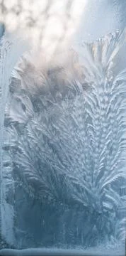 Frosty patterns on glass in winter Stock Photos