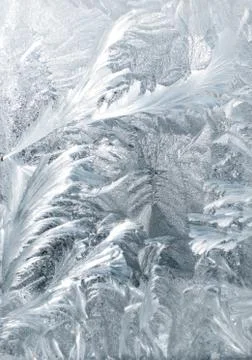 Frosty patterns on glass in winter Stock Photos